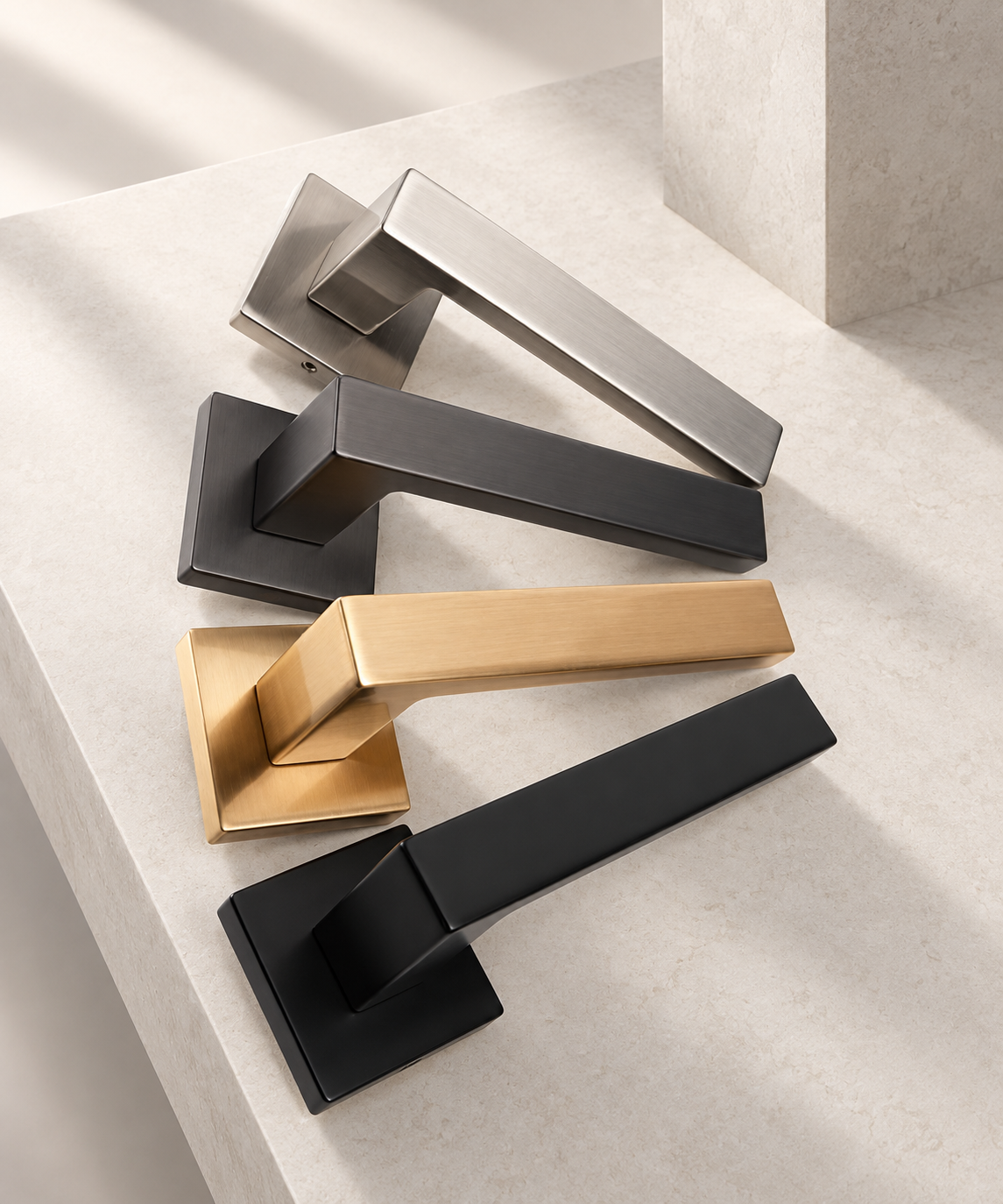 Four square-rosette lever handles in different finishes