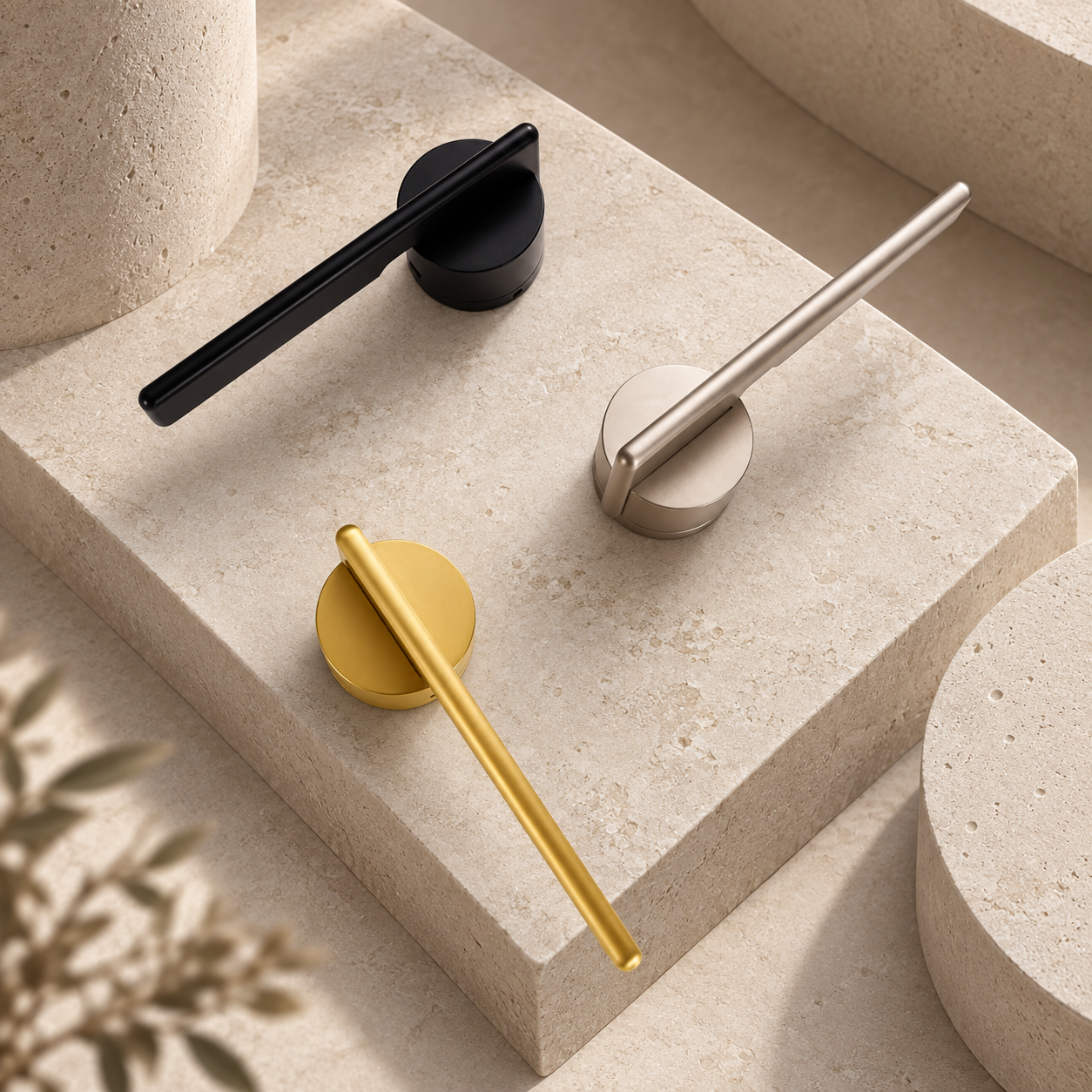 Three minimalist lever handles in black, silver and gold